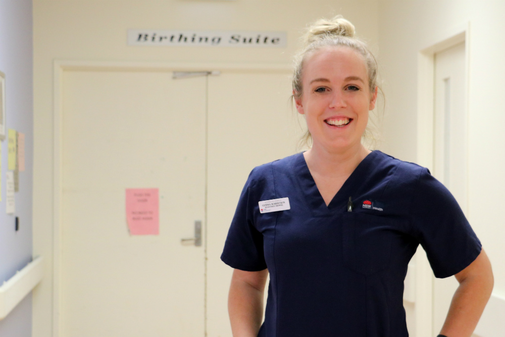 Midwife in front of delivery ward