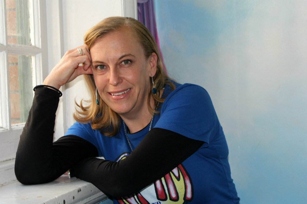 Lady leaning on windowsill