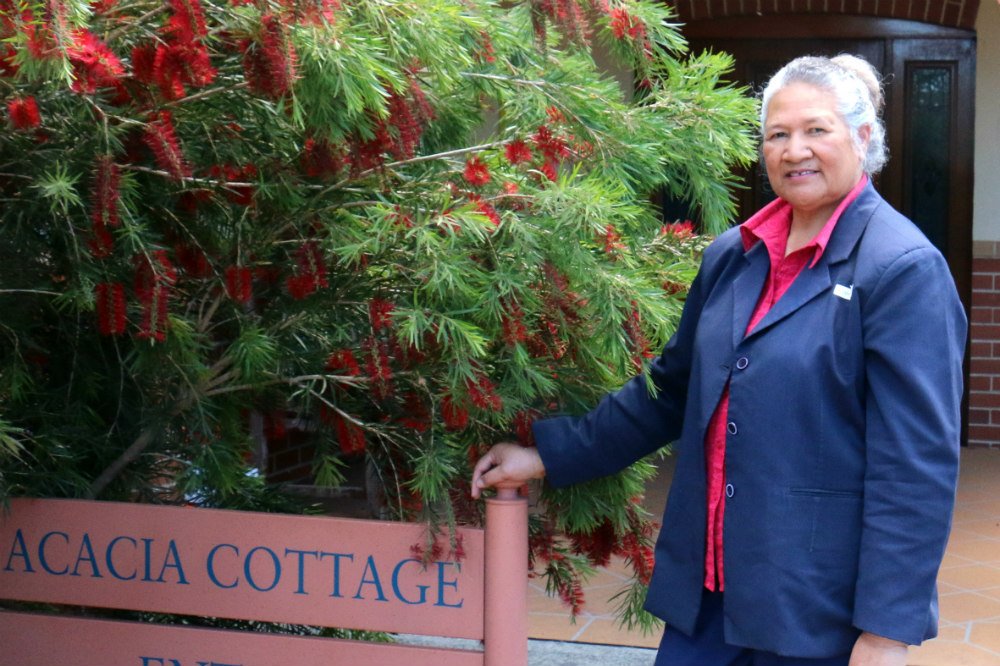 Lady in front of wattle tree