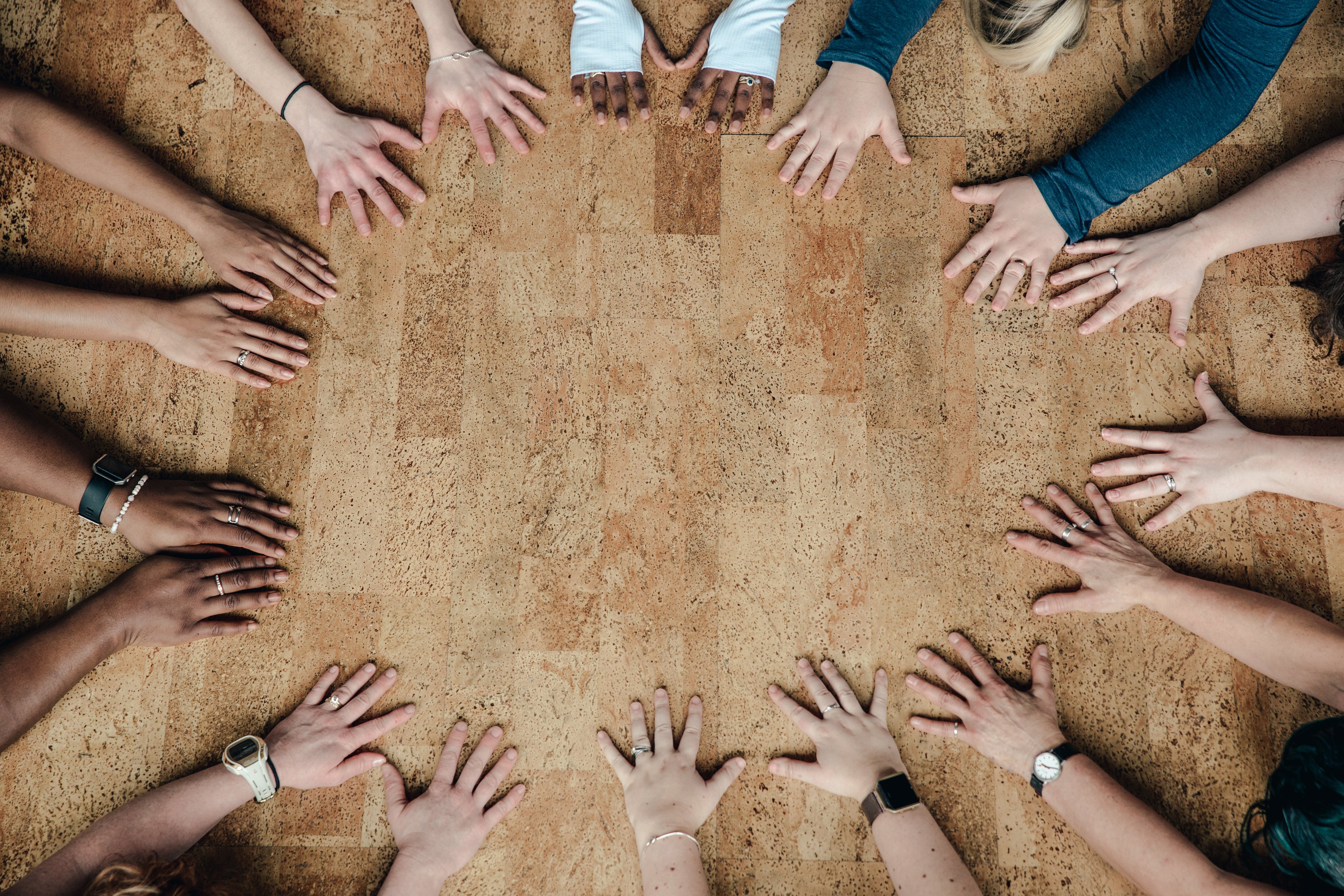 Women's hands forming a circle