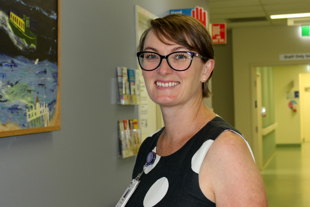 Woman in glasses in hallway