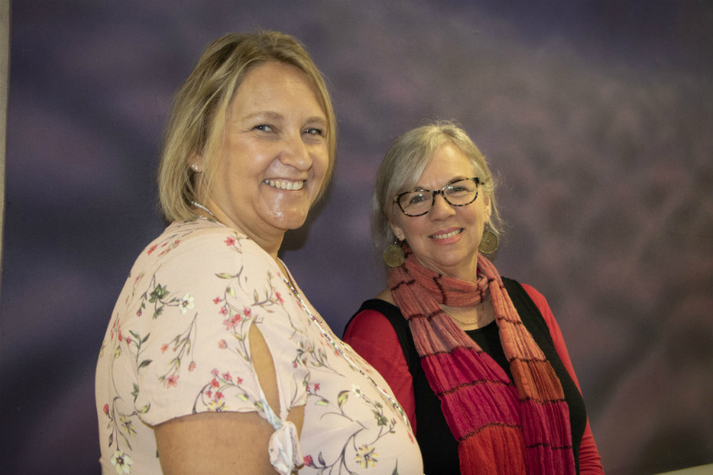 Two women smiling