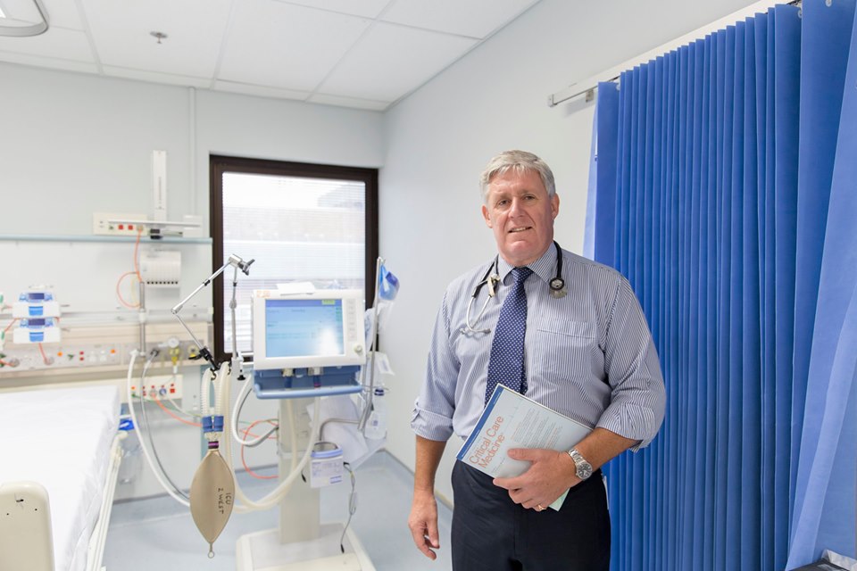 Gentleman standing in hospital ward setting