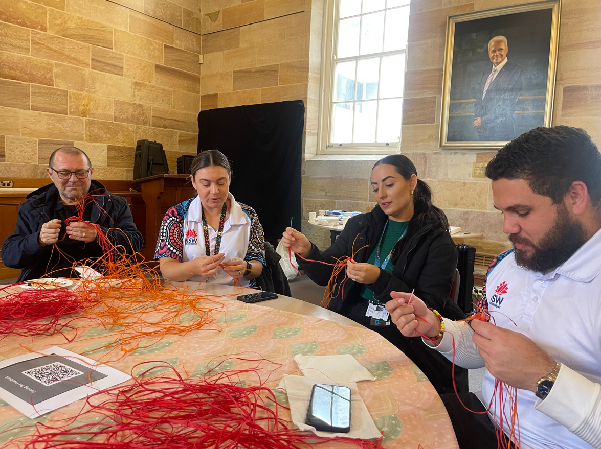 Coil weaving at the POWH yarning tea celebration