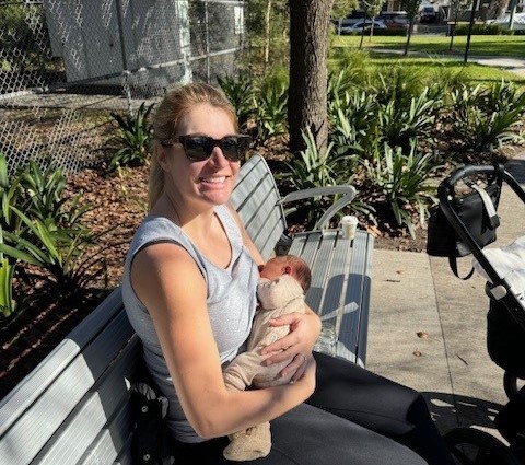 Mother and baby on park bench